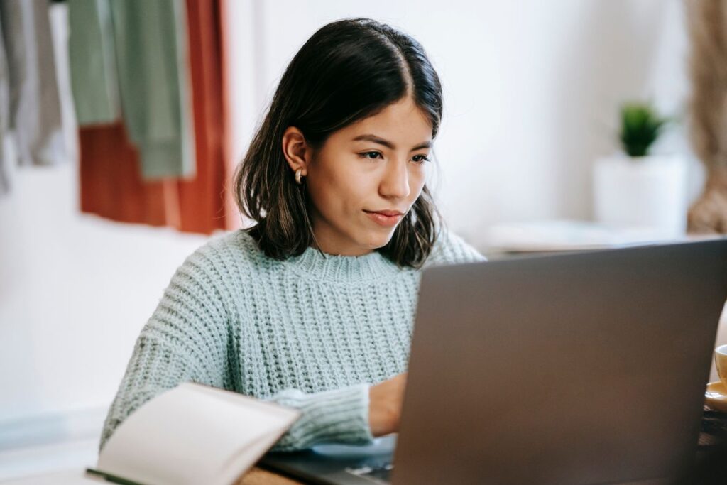 mother researching music schools online