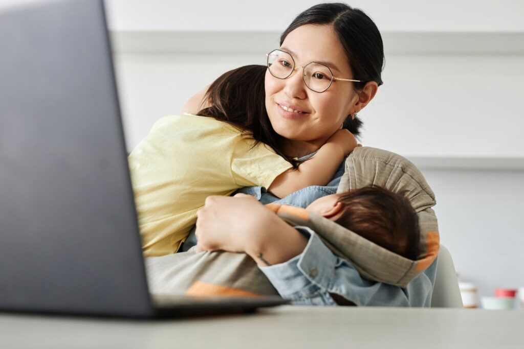 Mom with laptop and kids