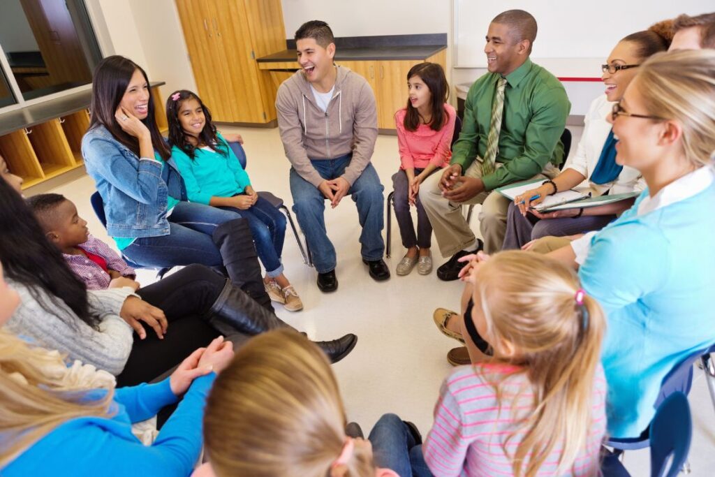 Teacher meeting with parents and students